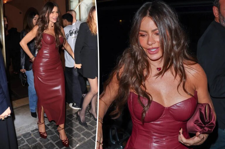 Sofia Vergara looked stunning in a body-hugging burgundy leather dress during Paris Fashion Week